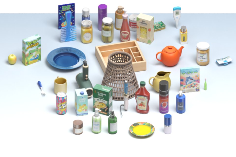 Dozens of reconstructed simulation assets — cereal boxes, jars, bottles, a teapot, a woven basket, plates — arranged on a table.